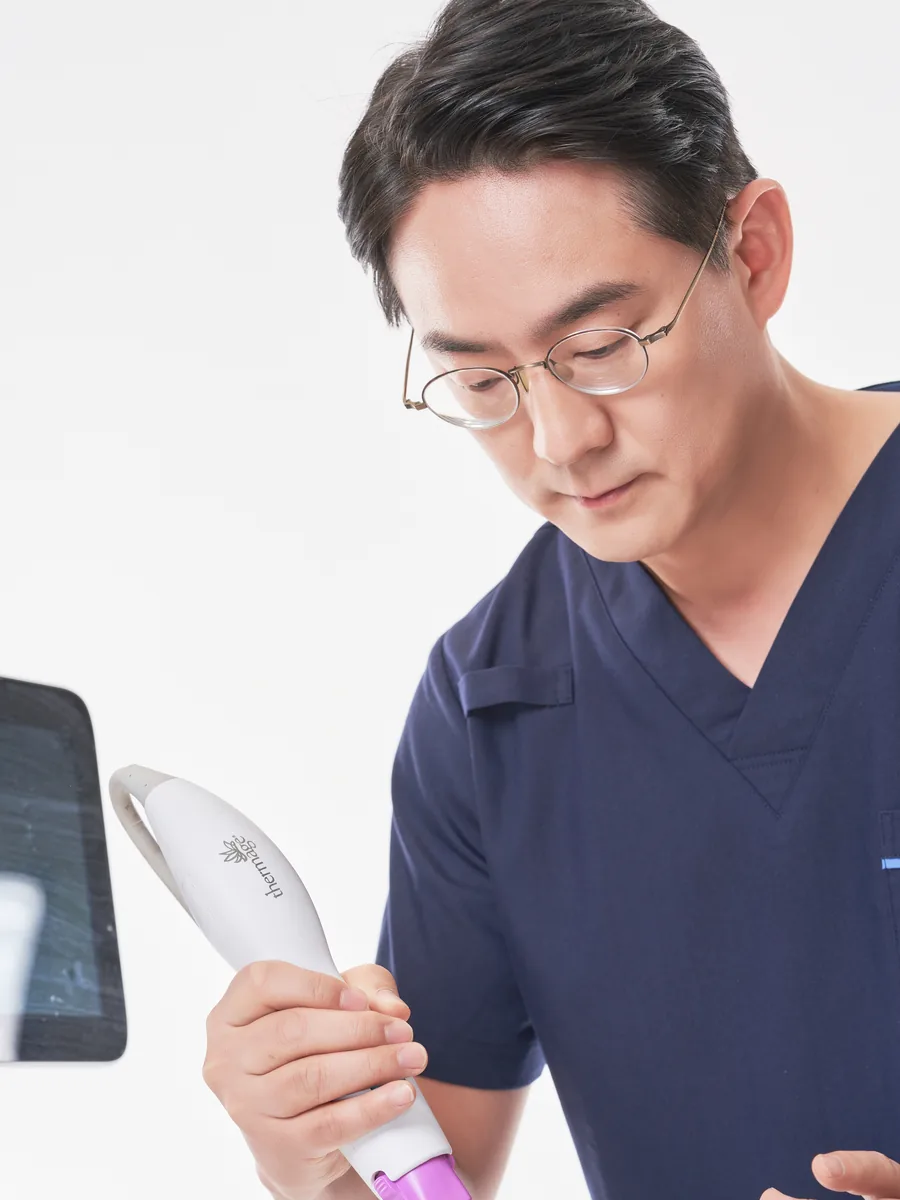 Dr. Won Woo Choi holding a Thermage handpiece at Wells Clinic, Apgujeong, Seoul